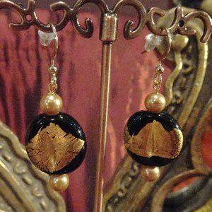 Handmade earrings in Czech lampwork design with gold  leaf on black tab